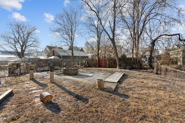 view of yard with a patio area and a fire pit