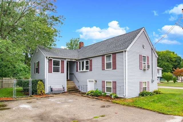 30 Deering Sq, Rockland, MA 02370 - view of front of home with a chimney, a shingled roof, a gate, and cooling unit