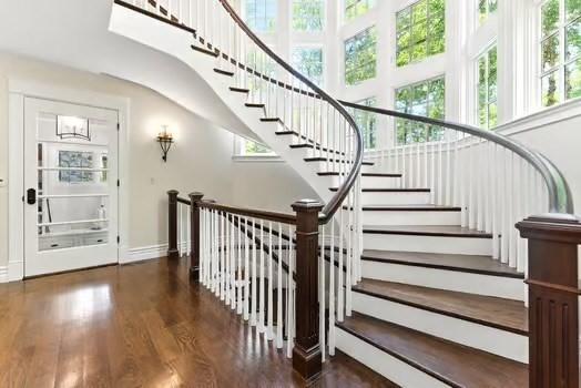 56 Cart Path Rd, Weston, MA 02493 - stairway featuring wood finished floors and baseboards