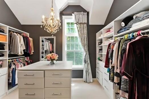 56 Cart Path Rd, Weston, MA 02493 - walk in closet with lofted ceiling and a chandelier