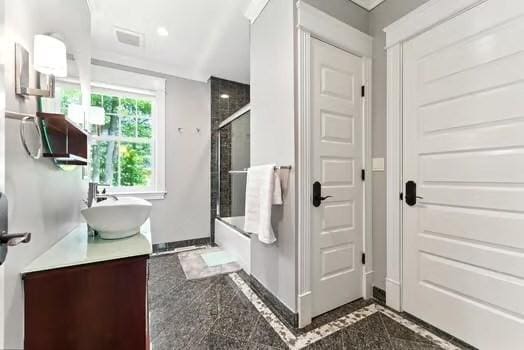56 Cart Path Rd, Weston, MA 02493 - bathroom featuring vanity, granite floors, and shower / bath combination with glass door