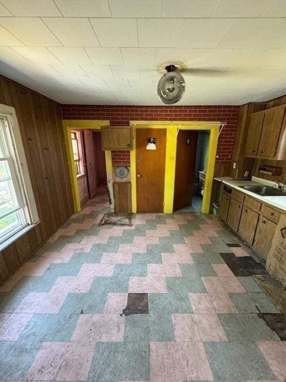 99 Beacon St, Boston, MA 02136 - kitchen with plenty of natural light, wooden walls, brown cabinetry, and light countertops