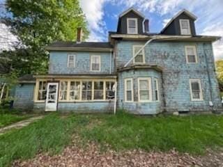 99 Beacon St, Boston, MA 02136 - back of property featuring a sunroom, a lawn, and a chimney