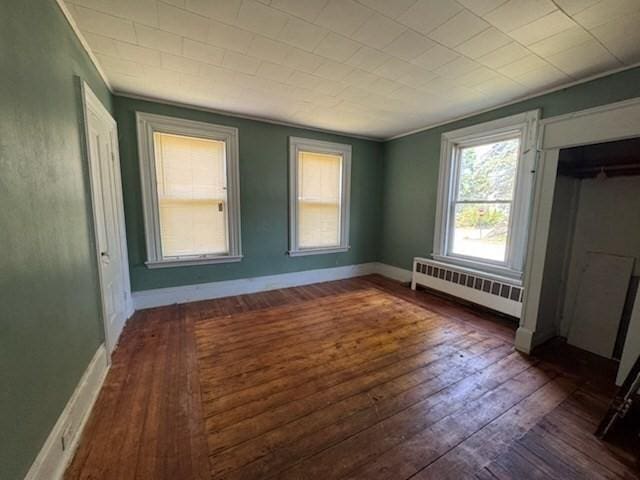 99 Beacon St, Boston, MA 02136 - unfurnished bedroom featuring radiator, dark wood finished floors, and crown molding