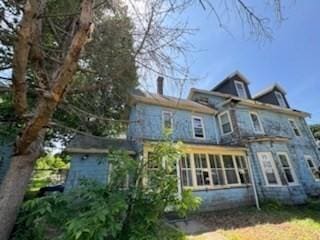 99 Beacon St, Boston, MA 02136 - rear view of house featuring a sunroom