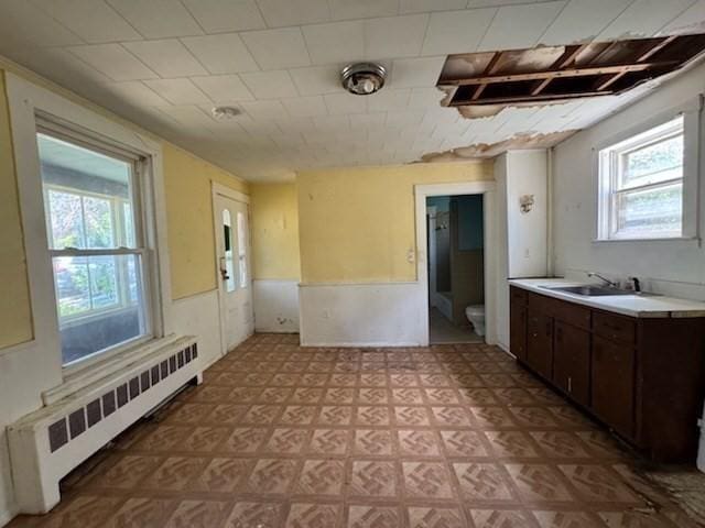 99 Beacon St, Boston, MA 02136 - bathroom featuring radiator heating unit, tile patterned floors, a wainscoted wall, and vanity