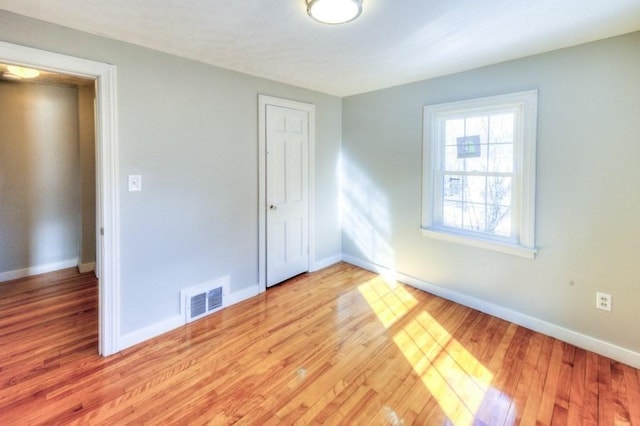 interior space featuring a closet and light hardwood / wood-style flooring