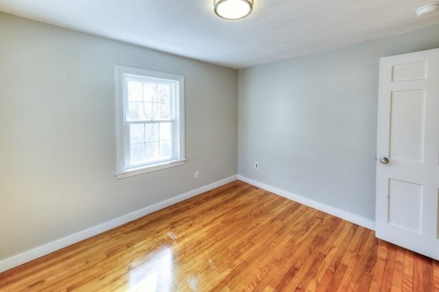 spare room with light wood-type flooring