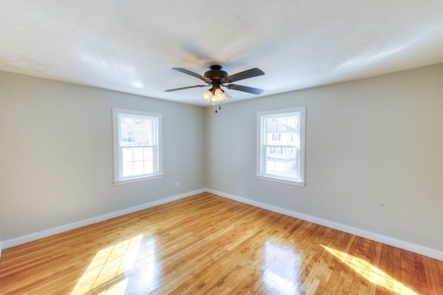 unfurnished room featuring ceiling fan and light wood-type flooring