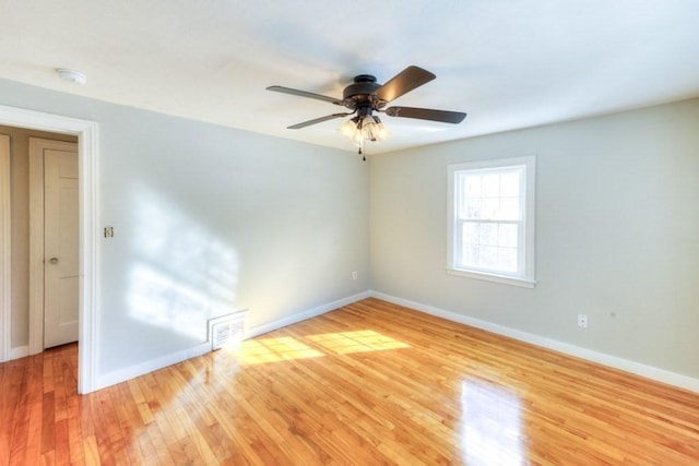 empty room featuring wood-type flooring and ceiling fan