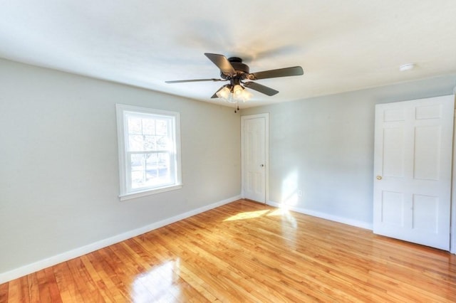 unfurnished room featuring ceiling fan and light wood-type flooring