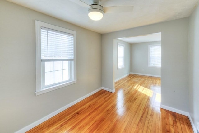 unfurnished room featuring ceiling fan and light wood-type flooring