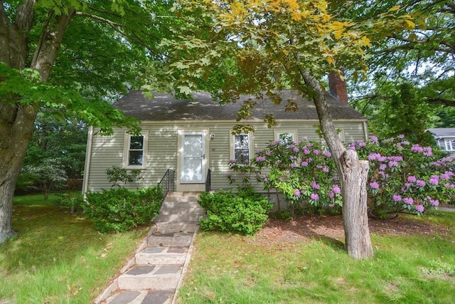 16 W St, Natick, MA 01760 - cape cod-style house featuring a chimney, a front lawn, and a shingled roof
