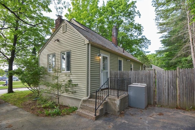 16 W St, Natick, MA 01760 - view of side of property with a chimney