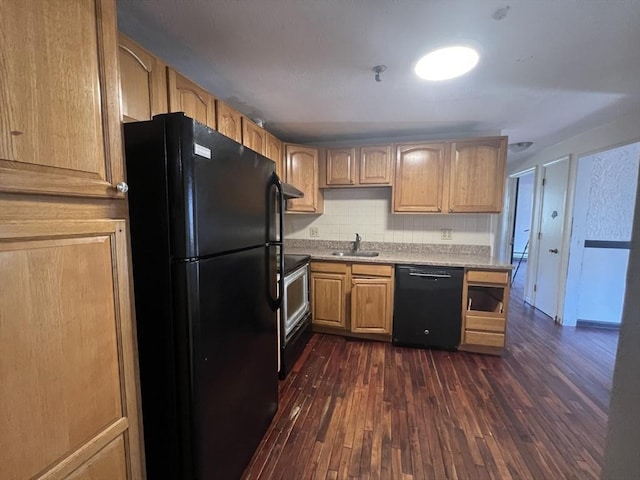 kitchen featuring a sink, light countertops, dark wood-style floors, black appliances, and tasteful backsplash