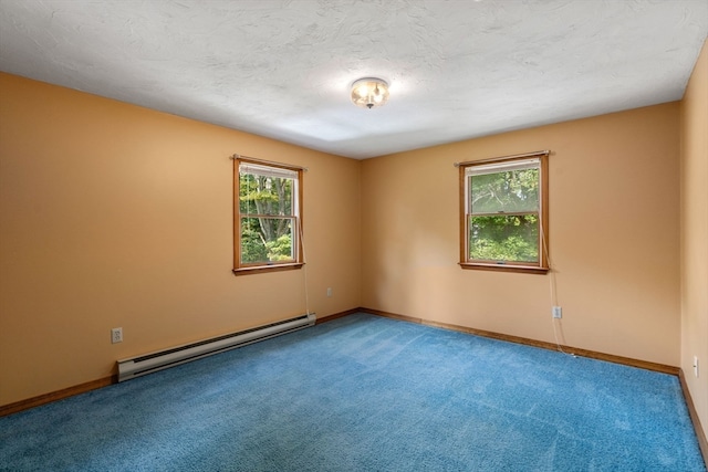 empty room with baseboard heating, plenty of natural light, and carpet flooring