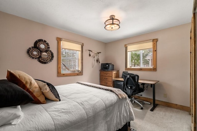 bedroom featuring carpet flooring and baseboards