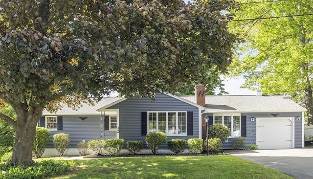 32 Arden St, Holyoke, MA 01040 - ranch-style home with a garage, driveway, a front yard, and a chimney