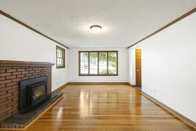 32 Arden St, Holyoke, MA 01040 - unfurnished living room with light wood-style floors, ornamental molding, and baseboards