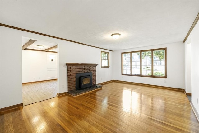32 Arden St, Holyoke, MA 01040 - unfurnished living room with wood finished floors, baseboards, ornamental molding, and a fireplace