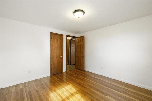 32 Arden St, Holyoke, MA 01040 - unfurnished room with baseboards and light wood-style flooring