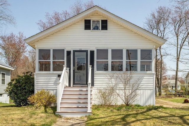 101 Euclid St, Gardner, MA 01440 - view of front of home with a sunroom and a front yard