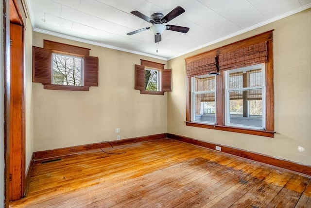 101 Euclid St, Gardner, MA 01440 - empty room featuring wood-type flooring, healthy amount of natural light, crown molding, ceiling fan, and baseboards