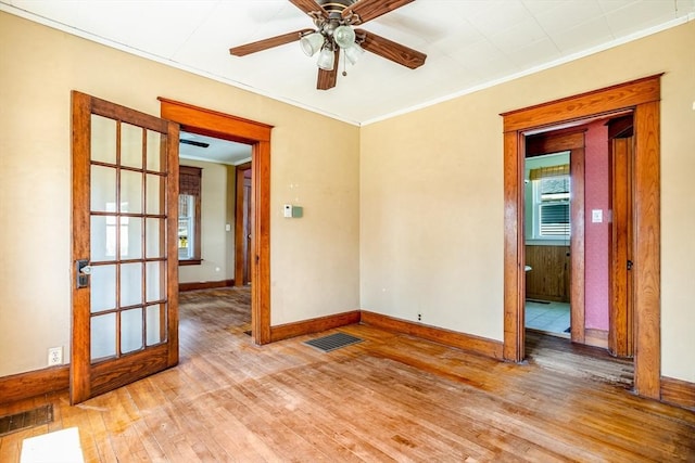 101 Euclid St, Gardner, MA 01440 - empty room featuring ornamental molding, plenty of natural light, light wood-style flooring, baseboards, and ceiling fan