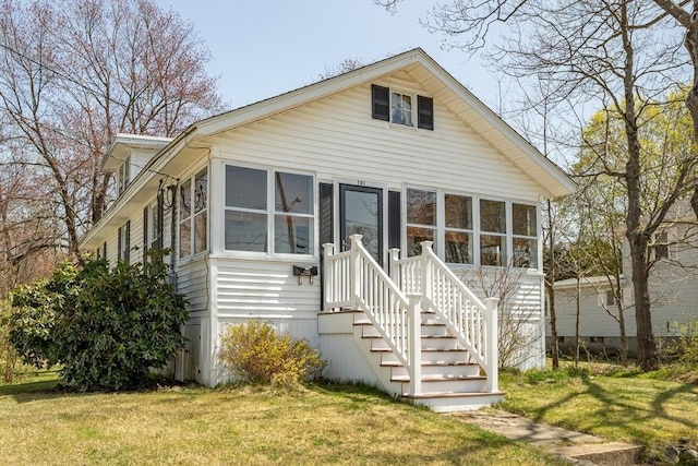 101 Euclid St, Gardner, MA 01440 - view of front of home with a front yard and a sunroom