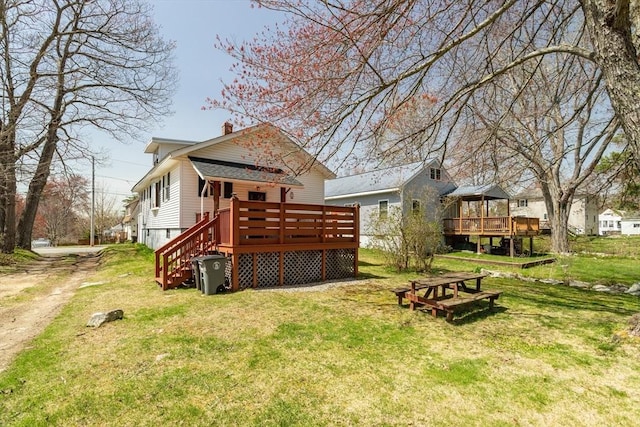 101 Euclid St, Gardner, MA 01440 - view of grassy yard featuring a wooden deck and stairs