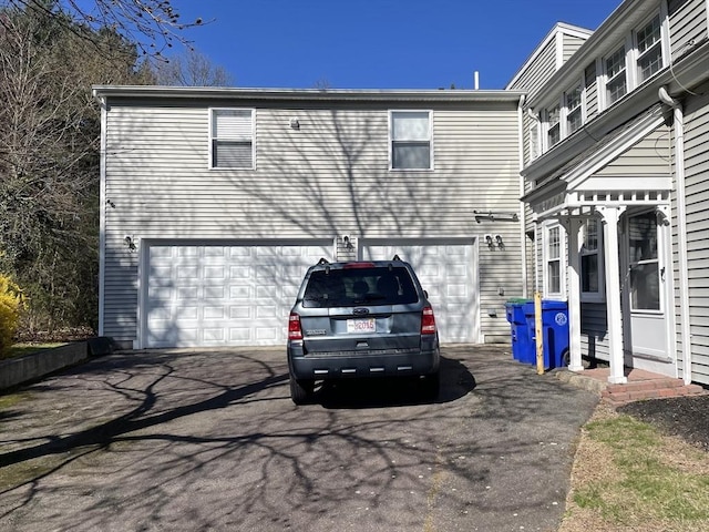 exterior space featuring a garage and driveway