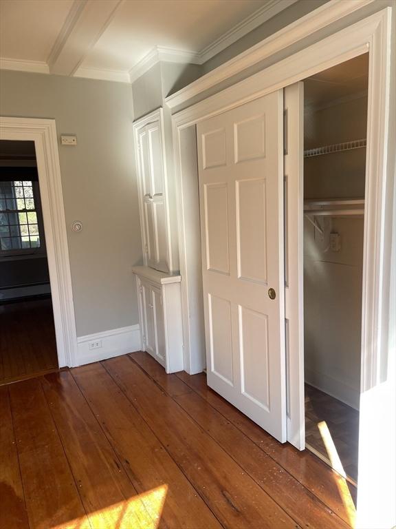 closet with a baseboard radiator