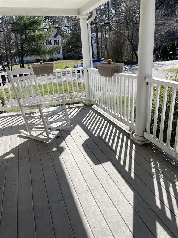 wooden terrace featuring covered porch