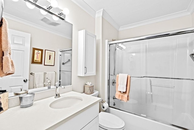 full bathroom with ornamental molding, vanity, enclosed tub / shower combo, and toilet