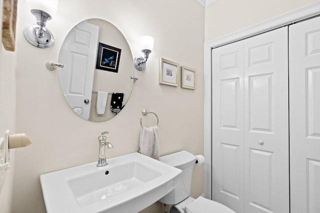 bathroom with toilet and sink