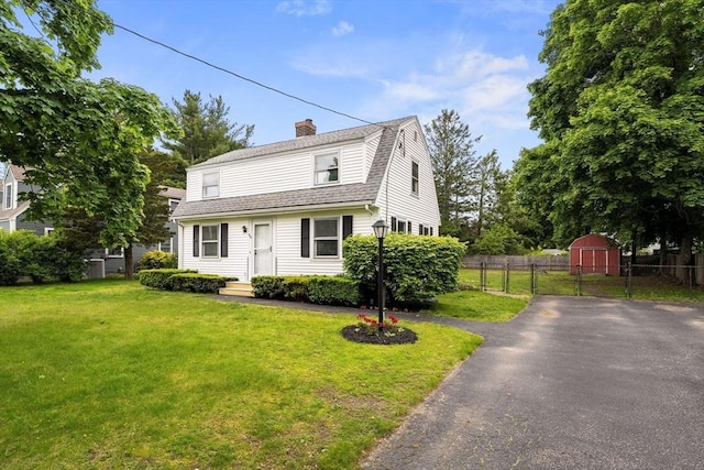 464 Ralph Talbot St, Weymouth, MA 02190 - dutch colonial featuring a gambrel roof, a chimney, roof with shingles, and asphalt driveway