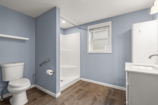 464 Ralph Talbot St, Weymouth, MA 02190 - bathroom with wood finished floors, vanity, toilet, and baseboards