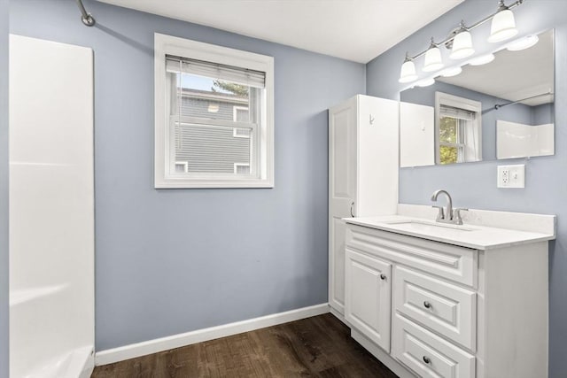 464 Ralph Talbot St, Weymouth, MA 02190 - bathroom featuring vanity, wood finished floors, healthy amount of natural light, and baseboards