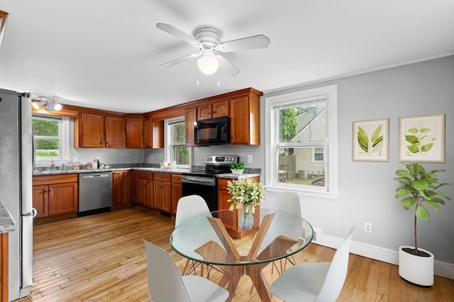 464 Ralph Talbot St, Weymouth, MA 02190 - kitchen featuring stainless steel appliances, baseboards, a ceiling fan, light wood finished floors, and a sink
