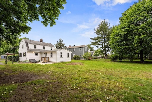 464 Ralph Talbot St, Weymouth, MA 02190 - rear view of house with a chimney