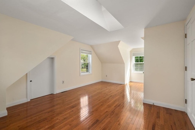 106 Nevada St, Newton, MA 02460 - additional living space featuring hardwood / wood-style flooring, healthy amount of natural light, baseboards, and lofted ceiling