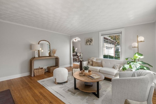106 Nevada St, Newton, MA 02460 - living area featuring arched walkways, hardwood / wood-style floors, baseboards, and ornamental molding