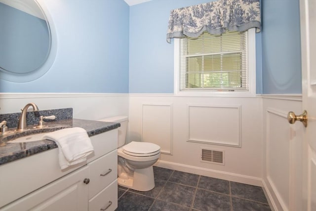 17 Stonepost Rd, Pelham, NH 03076 - half bathroom featuring wainscoting, vanity, tile patterned flooring, and toilet