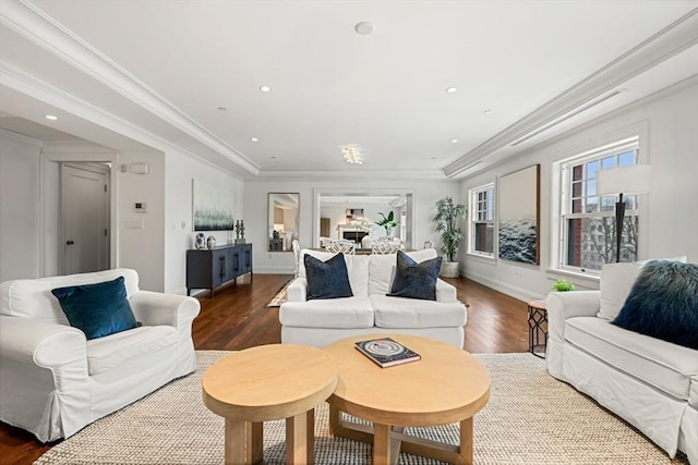 living room with baseboards, ornamental molding, wood finished floors, and recessed lighting