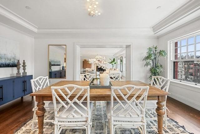 dining area featuring ornamental molding and dark wood-style flooring