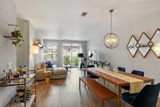 4 Harvest Dr Unit 225, North Andover, MA 01845 - dining space with wood finished floors and a chandelier