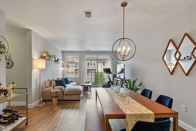 4 Harvest Dr Unit 225, North Andover, MA 01845 - dining area featuring wood finished floors and a chandelier
