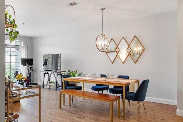 4 Harvest Dr Unit 225, North Andover, MA 01845 - dining space featuring a chandelier and wood finished floors