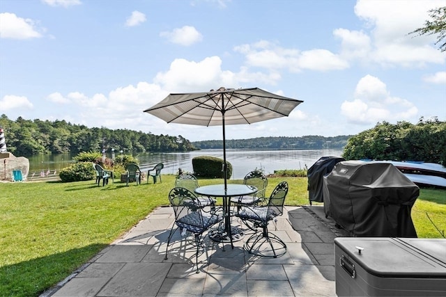 view of patio with a water view