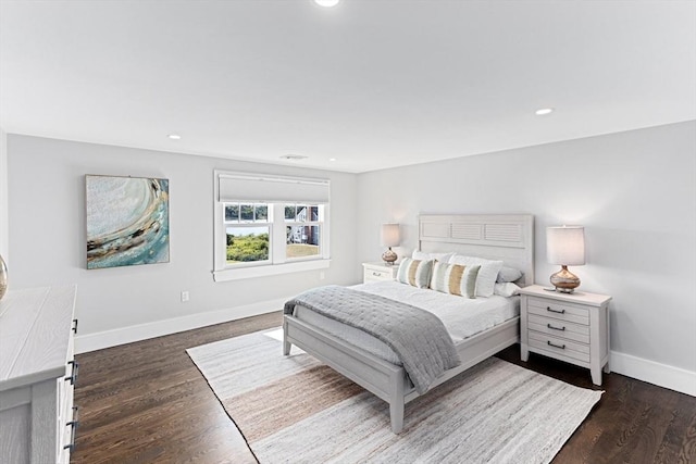 bedroom with recessed lighting, dark wood-type flooring, and baseboards